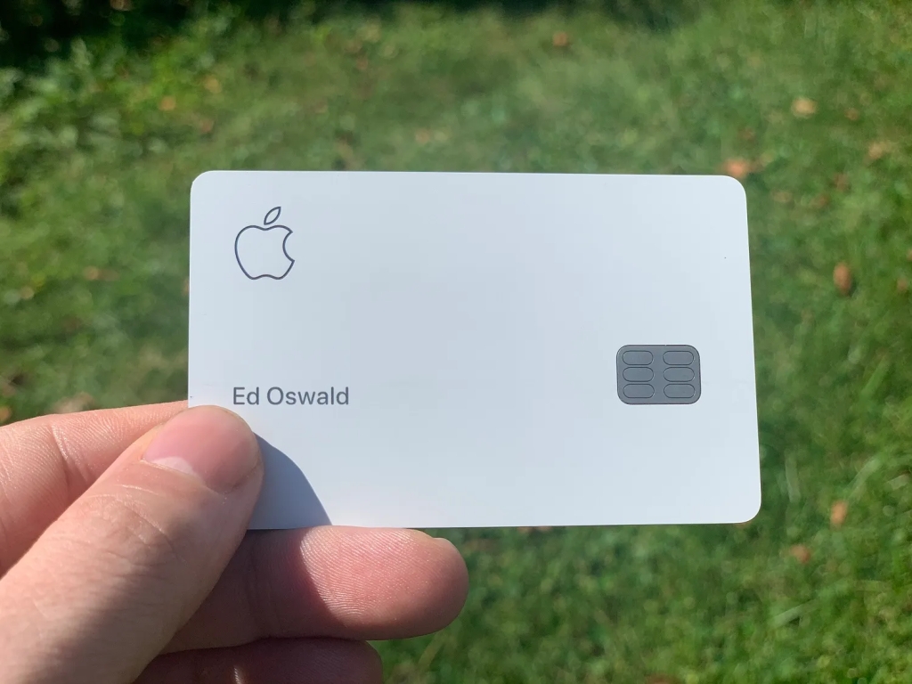 An image of a person holding an Apple Card